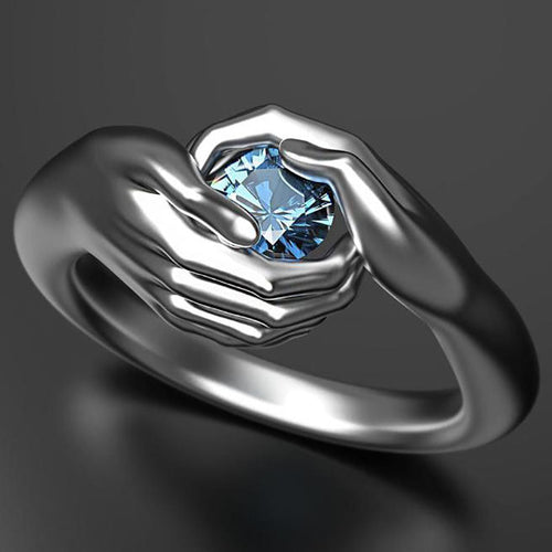 Hands Embracing Women's Ring