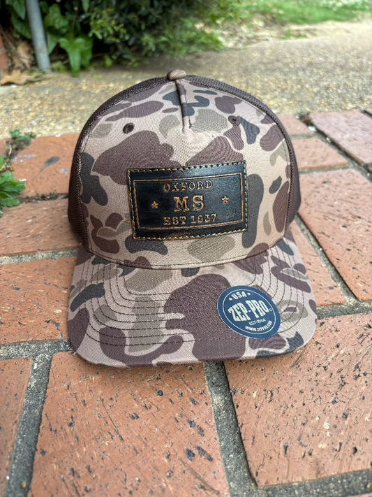 Zep-Pro rectangle leather patch with Oxford, Mississippi Established 1817 on an old school brown camo Richardson 112PFP cap. Cap features a brown mesh back and is adjustable. Front View