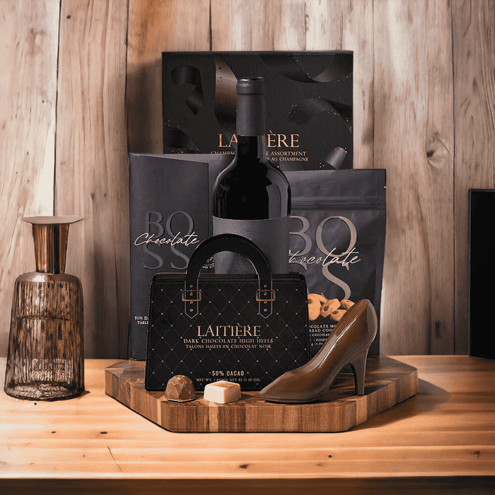 Chocolates charm everyone! Chocolate & Wine Gift Set features: Wine, Chocolate, Cookies, & Hexagonal Acacia End Grain cutting Board.