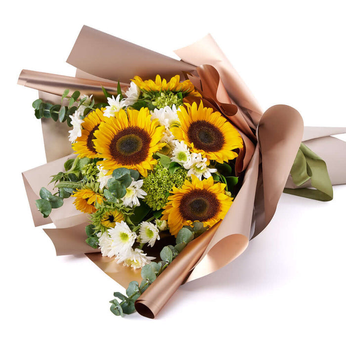 Eternal Sunshine Sunflower Bouquet. selection of sunflowers, green hydrangeas, daisies, eucalyptus, and ruscus carefully gathered in a floral wrap and tied with designer ribbon. Mixed Flower Gifts from Monthly Sommelier USA - Same Day USA Delivery.