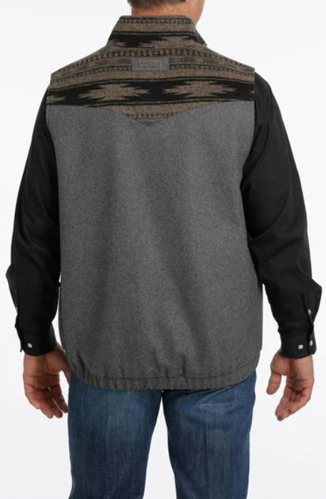 Cinch wooly charcoal vest with black and tan aztec printed yokes and collar. Fabric Cinch logo. Back view.